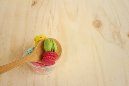 Colorful of macarons on background of brown wood.の写真素材