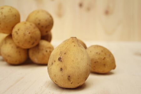 Longkongs on a background of brown wood.の写真素材