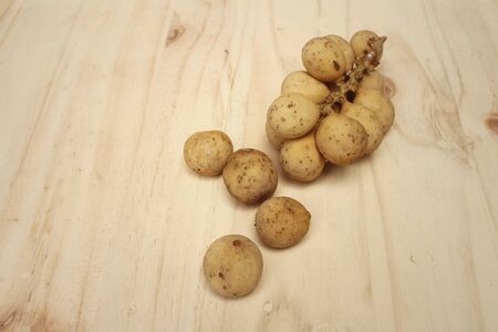Longkongs on a background of brown wood.の写真素材