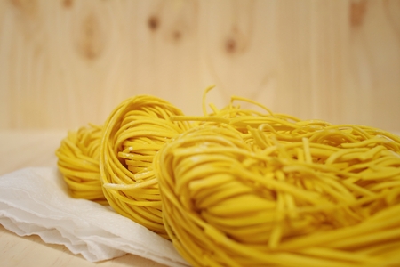 noodles on a background of brown wooden.の写真素材
