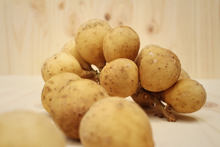 Longkongs on a background of brown wood.の写真素材