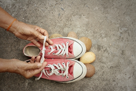Red shoes on the background of the cement.の写真素材