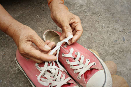 Red shoes on the background of the cement.の写真素材