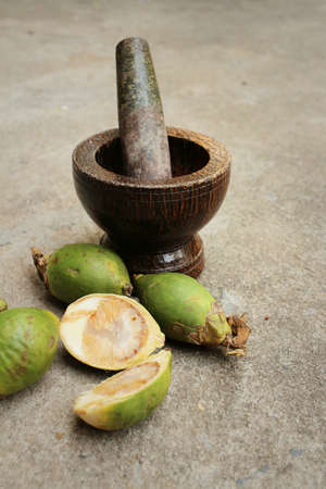 Betel palms on background of a cement.