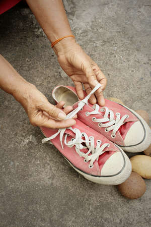Red shoes on the background of the cement.の写真素材