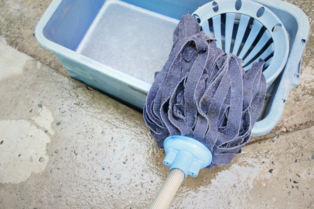 Blue bucket with cleaning mop for cleaningの写真素材