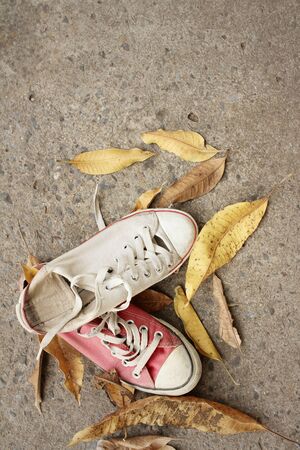 Red and white shoes on background of cement.の写真素材