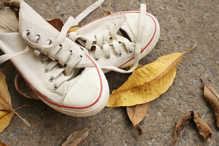 White shoes on background of cement.の写真素材