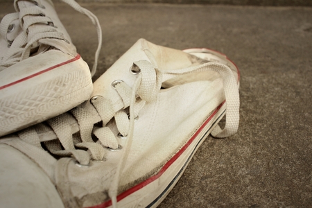 White shoes on background of cement.の写真素材
