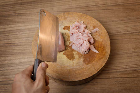 cutting Raw pork meat on cutting board