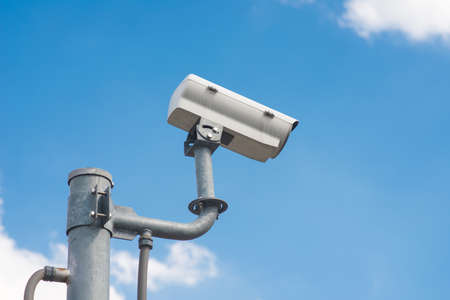 CCTV Security camera in sky background