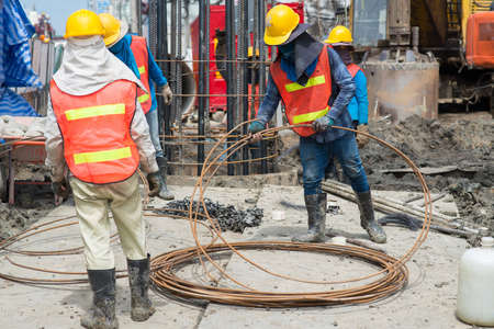 Construction workers working in site bridge piling