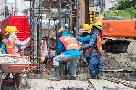 Construction workers working in site bridge pilingの写真素材