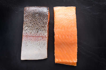 Fresh salmon  fillet on black background.の写真素材
