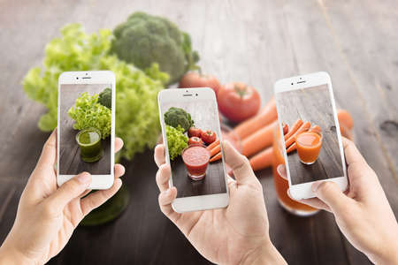 Taking photo of vegetable Juices with fresh ingredientsの写真素材