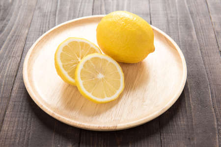 Fresh lemons on wooden background.の写真素材