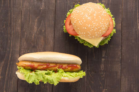 Hot dogs,hamburgers on the wooden backgroundの写真素材