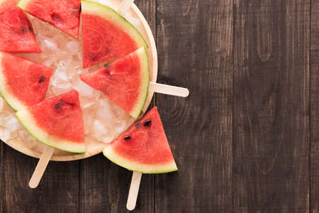 Fruit ice cream sliced watermelon on wooden background.の写真素材