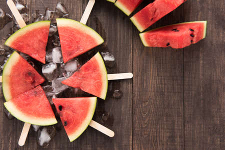 Fruit ice cream sliced watermelon on wooden background.の写真素材