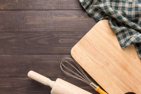 wooden kitchen tools and napkin on the wooden background.の写真素材