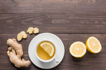 Ginger tea with lemon on the wooden background.の写真素材
