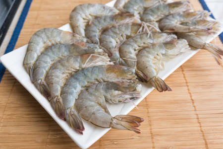 Cluster of raw shrimp on the table.の写真素材