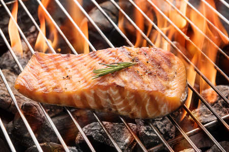 Grilled salmon steak on the flaming.の写真素材