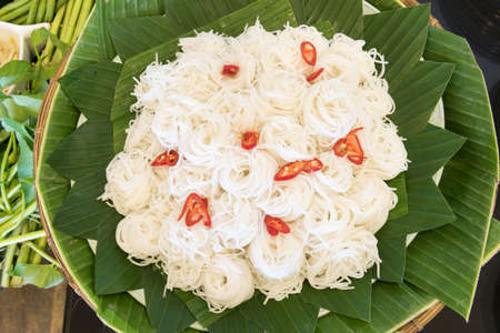 Thai rice vermicelli on a green banana leaf.