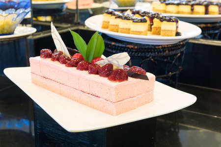Cake pieces of strawberry on a white dish.の写真素材