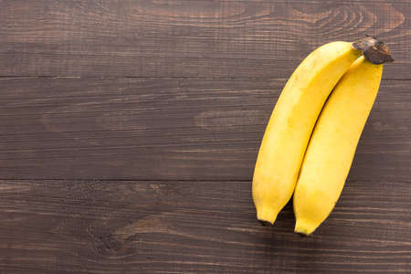 Banana on the wooden background. Top view.の写真素材