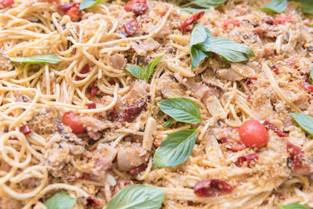 Background spaghetti with parmesan cheese, pork, tomato, herbの写真素材