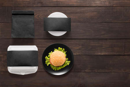Black concept burger set on wooden background. Copy space for text.の写真素材