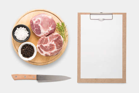 Design concept of mockup clip board and pork on cutting board set isolated on white background....