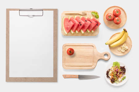 Design concept of mockup fresh vegetable, fruits and clip board set isolated on white background. Copy space for text and logo.の写真素材
