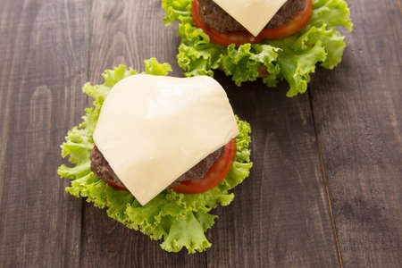 Hamburger with Lettuce and Cheese on wooden table.の写真素材