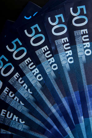 Close up of eight notes of fifty euros