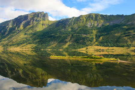 Wonderful panorama of Norwegian mountains and rocks that are reflected in the water.の写真素材