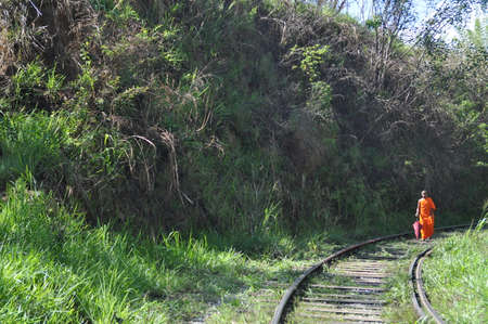 Monk on a rail road near the city of Ella, Sri Lanka.の写真素材