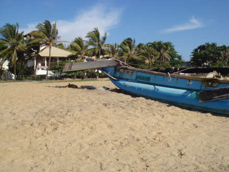 A catamaran fishing boat on a beach in Sri Lanka.の写真素材