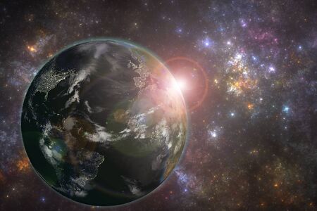 Planet Earth with night city lights and rising sun. Elements of this image furnished by NASAの写真素材