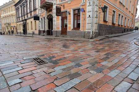 VILNIUS, LITHUANIA - DECEMBER 30, 2016: Colorful cobbled street and facades in the Old Townのeditorial素材