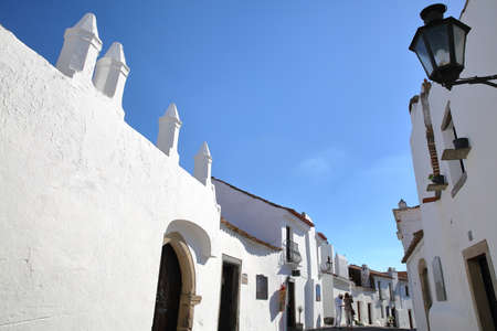 MONSARAZ, PORTUGAL - OCTOBER 11, 2016: A typical cobbled street with whitewashed housesのeditorial素材