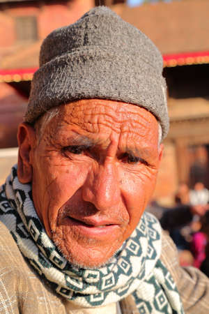 PATAN, NEPAL - DECEMBER 21, 2014: Portrait of an old Nepalese man at Durbar Squareのeditorial素材