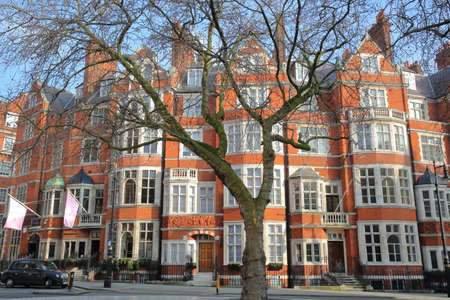 LONDON, UK - FEBRUARY 13, 2017: Red brick Victorian houses facades at Carlos Place in the borough of...