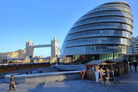LONDON, UK - DECEMBER 31, 2015: View of The City Hall and the Tower Bridge with Winter Market stalls in the foregroundのeditorial素材