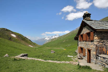 VANOISE, FRANCE - JUNE 24, 2016: The Vallonbrun refuge with a summit (La Dent ParrachÃÂ©e) in the background, Northern Alpsのeditorial素材