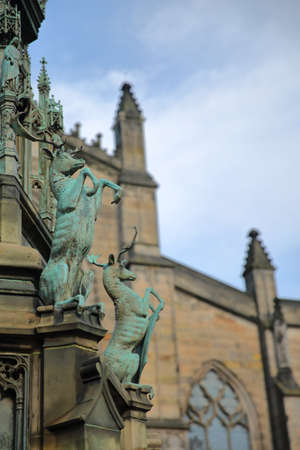 EDINBURGH, SCOTLAND: St. Giles Cathedral (High Kirk of Edinburgh) with Duke of Buccleuch (Walter Scott) Statue in the foreground on Royal Mileの写真素材
