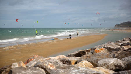 WISSANT, FRANCE - AUGUST 28, 2016: The beach with kite surfers. View with the Cap Blanc Nez in the backgroundのeditorial素材