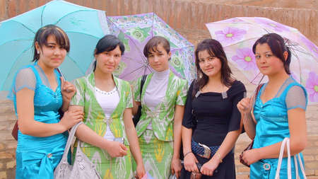 KHIVA, UZBEKISTAN - MAY 5, 2011: Portrait of Uzbek young women on a rainy dayのeditorial素材