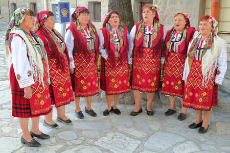 BANSKO, BULGARIA - JULY 25, 2015: Women traditionally dressed singing Bulgarian songsのeditorial素材